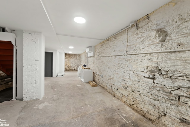 unfinished basement featuring stairs