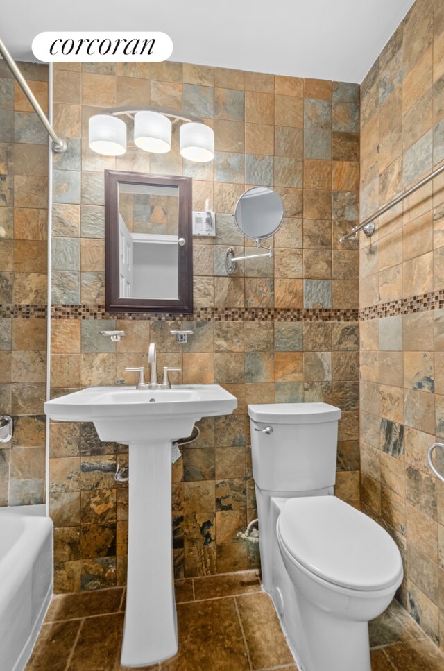 1655 Flatbush Ave Unit A602, New York City, NY 11210 - full bath featuring tile walls, toilet, and  shower combination