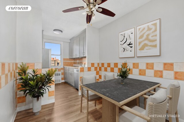 1655 Flatbush Ave Unit A602, New York City, NY 11210 - dining space with a ceiling fan, light wood finished floors, and radiator
