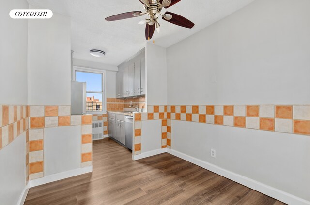 1655 Flatbush Ave Unit A602, New York City, NY 11210 - unfurnished room featuring dark wood-style flooring, ceiling fan, and baseboards