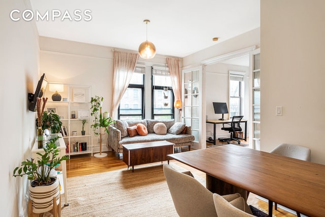31 Tiemann Pl Unit 37, New York City, NY 10027 - living area with light wood-style flooring and a desk