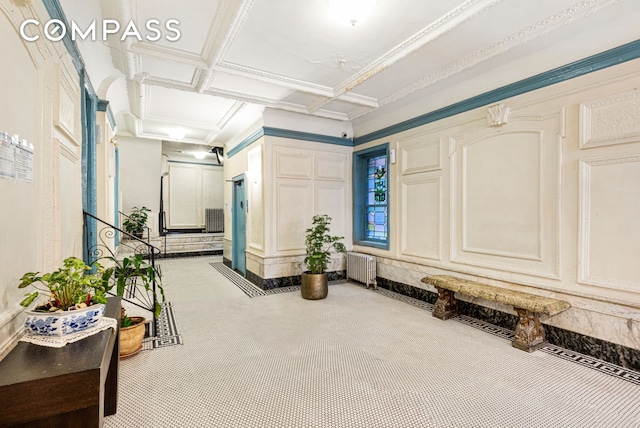 31 Tiemann Pl Unit 37, New York City, NY 10027 - hallway with carpet floors, coffered ceiling, and radiator heating unit