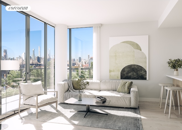 27-09 40th Ave Unit 6H, New York City, NY 11101 - living room featuring a view of skyline, healthy amount of natural light, wood finished floors, expansive windows, and baseboards