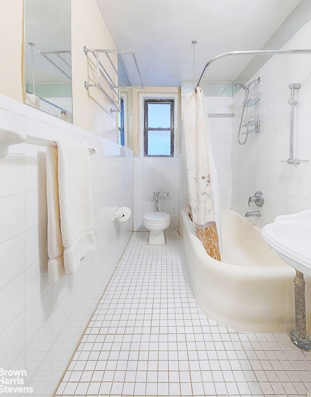 155 E 91st St Unit 3D, New York City, NY 10128 - full bathroom featuring toilet, tile patterned floors, tile walls, and shower / bath combination with curtain