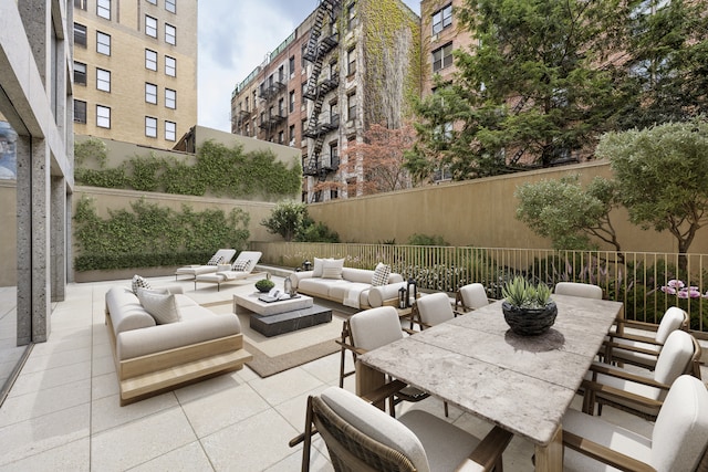 view of patio featuring an outdoor living space, fence, and outdoor dining space