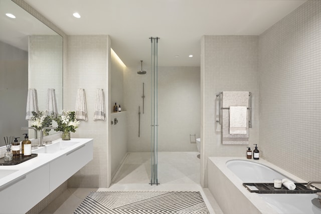 251 W 14th St Unit 1A, New York City, NY 10011 - full bath featuring a bath, walk in shower, recessed lighting, toilet, and tile walls