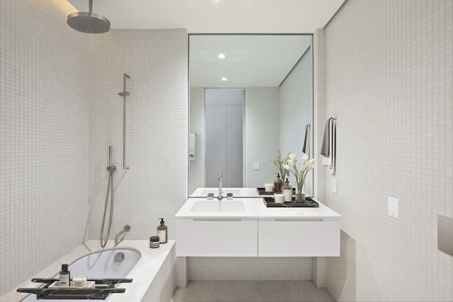 full bath featuring recessed lighting, tile walls, tile patterned flooring, and vanity