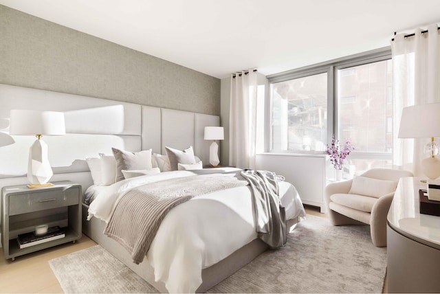 bedroom with light wood-style floors