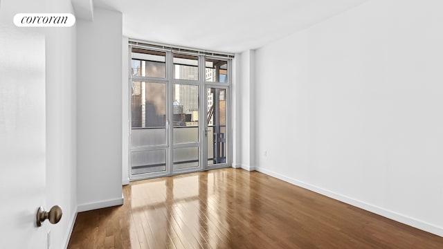 1600 Broadway Unit 17A, New York City, NY 10019 - unfurnished room featuring hardwood / wood-style flooring and baseboards