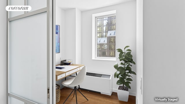 1600 Broadway Unit 17A, New York City, NY 10019 - home office with radiator and wood finished floors