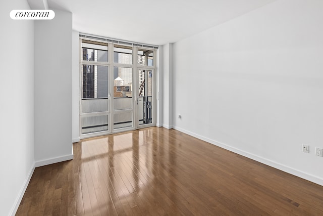 1600 Broadway Unit 17A, New York City, NY 10019 - unfurnished room featuring wood-type flooring and baseboards