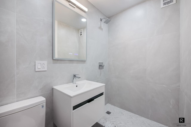 3777 Independence Ave Unit 2-B, New York City, NY 10463 - bathroom with vanity, a tile shower, and tile walls