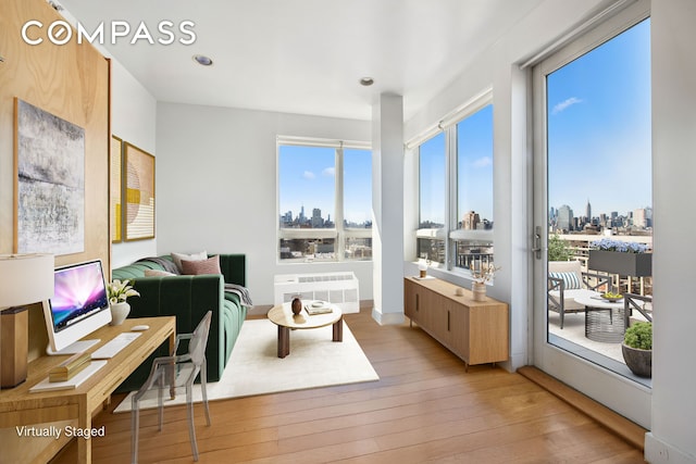 sunroom / solarium featuring a view of city