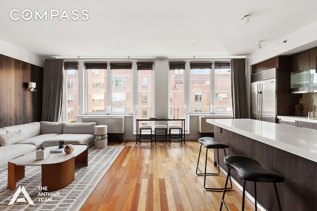 125 W 21st St Unit 12A, New York City, NY 10011 - living room with light wood finished floors