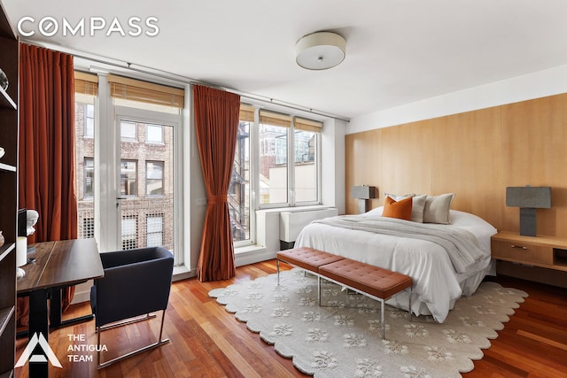 125 W 21st St Unit 12A, New York City, NY 10011 - bedroom featuring wood finished floors and access to exterior