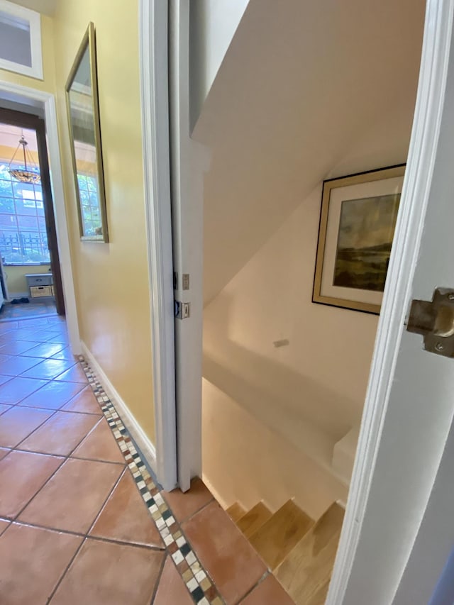 34 Fort Charles Place, New York City, NY 10463 - hallway featuring light tile patterned floors and a chandelier