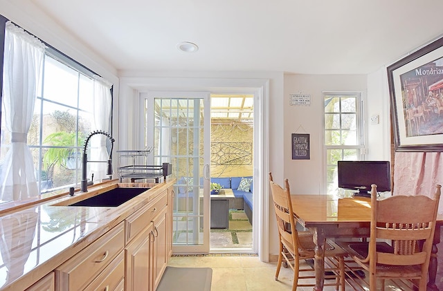 34 Fort Charles Place, New York City, NY 10463 - kitchen with a sink, french doors, and light tile patterned floors