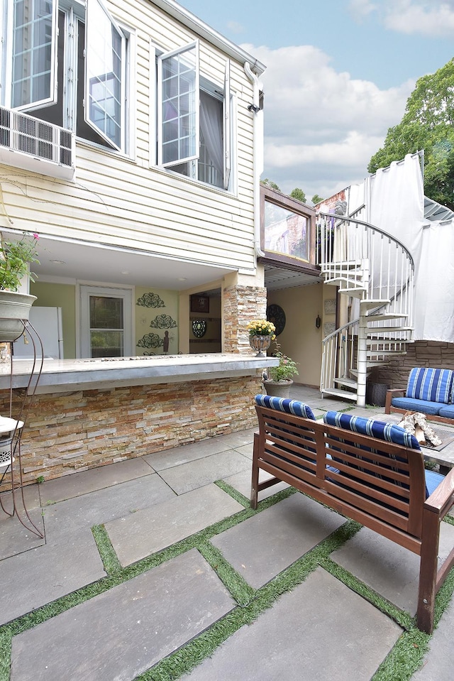 34 Fort Charles Place, New York City, NY 10463 - view of patio / terrace with stairway and outdoor lounge area