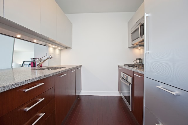 100 Riverside Blvd Unit 11J, New York City, NY 10069 - kitchen featuring stainless steel appliances, modern cabinets, decorative backsplash, and white cabinets