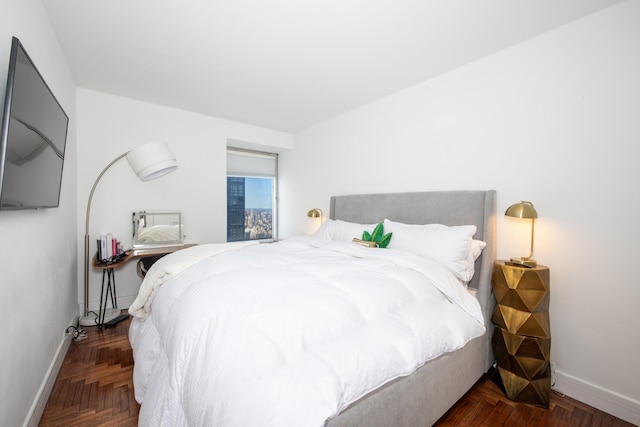 bedroom featuring baseboards