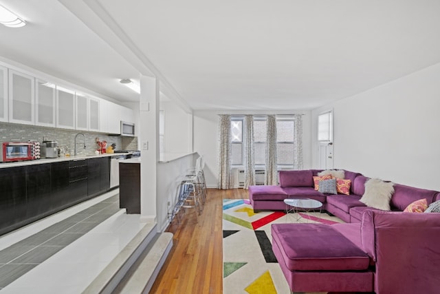 79-10 34th Ave Unit 3S, New York City, NY 11372 - living area featuring wood finished floors