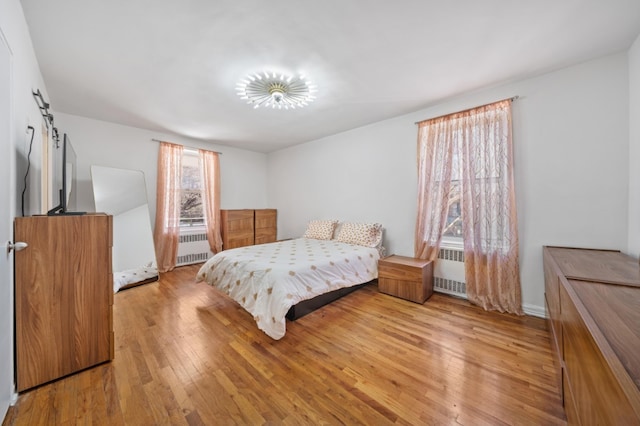 79-10 34th Ave Unit 3S, New York City, NY 11372 - bedroom with radiator and light wood finished floors