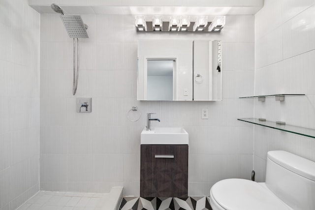 79-10 34th Ave Unit 3S, New York City, NY 11372 - full bath with a tile shower, vanity, toilet, and tile walls