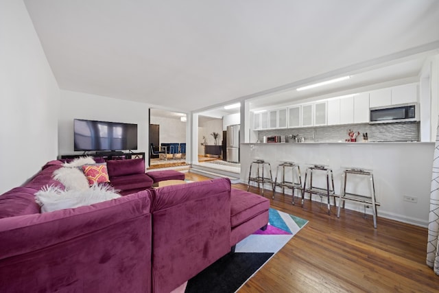 79-10 34th Ave Unit 3S, New York City, NY 11372 - living room with wood finished floors