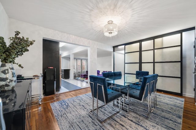 79-10 34th Ave Unit 3S, New York City, NY 11372 - dining area with wood finished floors and a chandelier