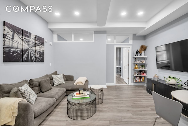 living area featuring wood finished floors, recessed lighting, and baseboards