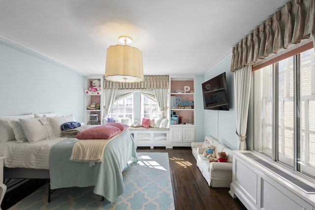 333 E 68th Street Penthouse, New York City, NY 10065 - bedroom with crown molding, multiple windows, and dark wood-style flooring