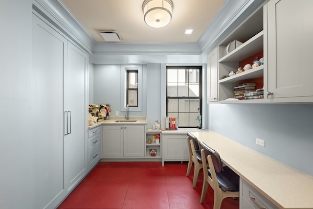 333 E 68th Street Penthouse, New York City, NY 10065 - office with built in desk, a sink, and crown molding