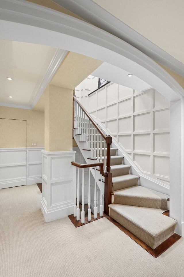 333 E 68th Street Penthouse, New York City, NY 10065 - home office featuring built in study area, a sink, and ornamental molding