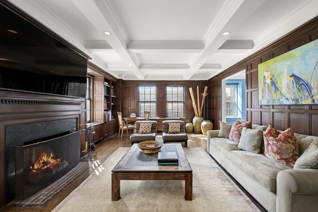 333 E 68th Street Penthouse, New York City, NY 10065 - living area featuring ornamental molding, beamed ceiling, a high end fireplace, recessed lighting, and coffered ceiling