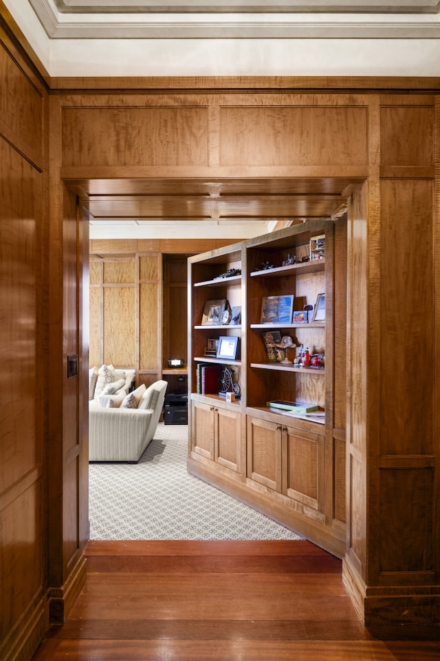 333 E 68th Street Penthouse, New York City, NY 10065 - detailed view of wood walls, wood finished floors, and crown molding