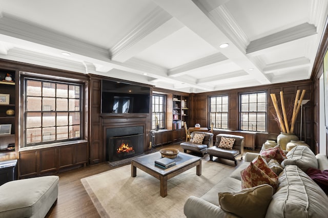 333 E 68th Street Penthouse, New York City, NY 10065 - living area with crown molding, beam ceiling, a fireplace with flush hearth, wood finished floors, and built in features
