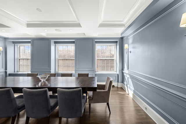333 E 68th Street Penthouse, New York City, NY 10065 - dining area featuring a decorative wall, crown molding, healthy amount of natural light, dark wood-style floors, and baseboards