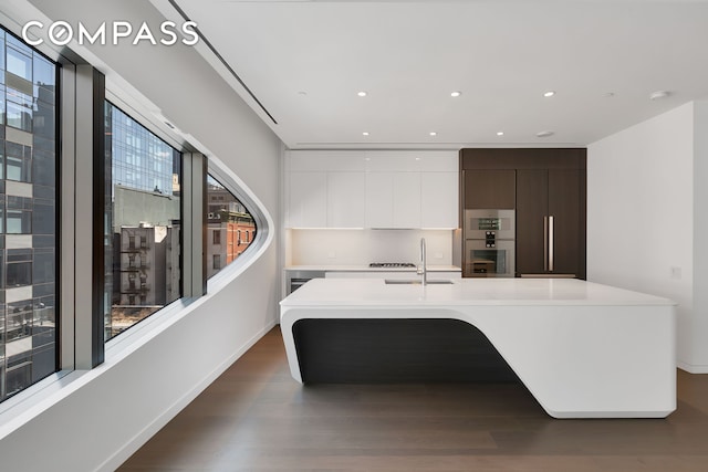 520 W 28th St Unit 18, New York City, NY 10001 - kitchen with modern cabinets, healthy amount of natural light, light countertops, and recessed lighting