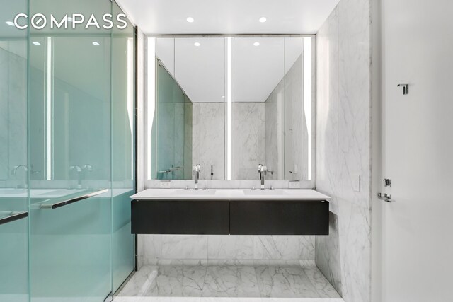 520 W 28th St Unit 18, New York City, NY 10001 - bathroom featuring double vanity, recessed lighting, and a sink