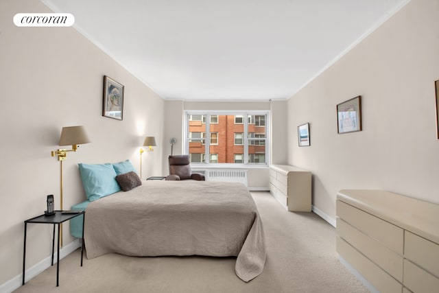 carpeted bedroom with radiator heating unit, baseboards, ornamental molding, and visible vents