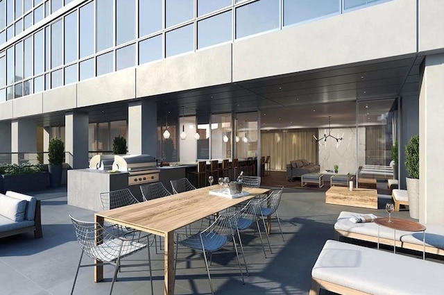 exterior space with outdoor dining area, a grill, and exterior kitchen