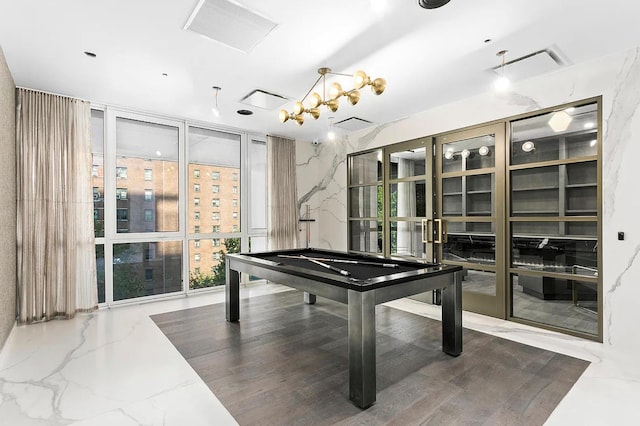 rec room with a wall of windows and billiards