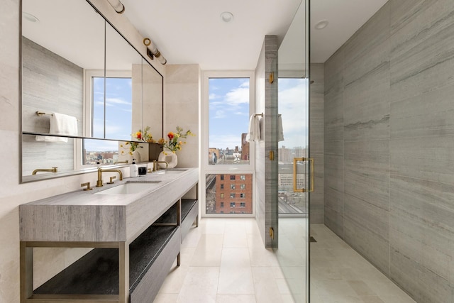 bathroom featuring vanity, a city view, tile patterned flooring, and a stall shower