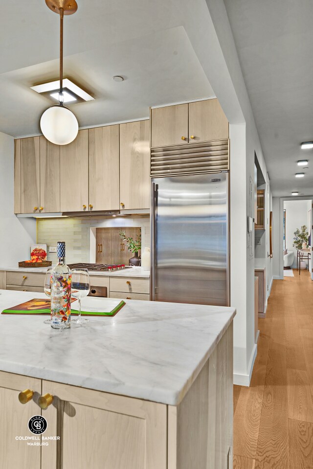 212 E 95th St Unit 2Ab, New York City, NY 10128 - kitchen with built in refrigerator, light brown cabinets, decorative backsplash, light wood-style flooring, and recessed lighting