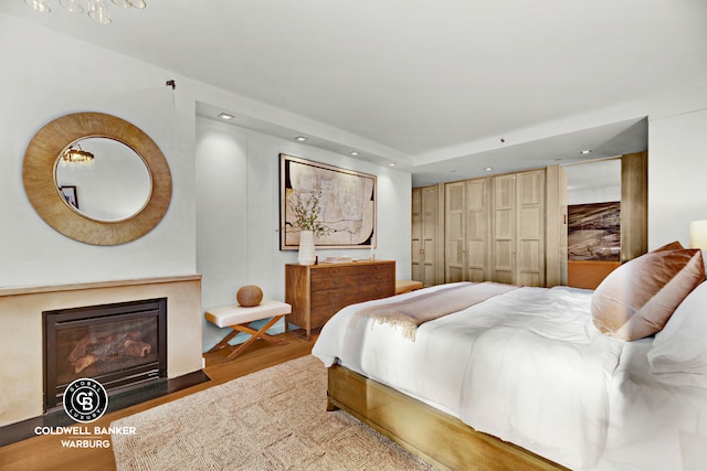 212 E 95th St Unit 2Ab, New York City, NY 10128 - bedroom featuring wood finished floors, recessed lighting, and a fireplace with flush hearth