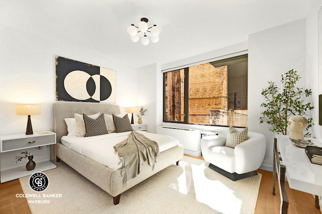 212 E 95th St Unit 2Ab, New York City, NY 10128 - bedroom featuring wood finished floors and a chandelier