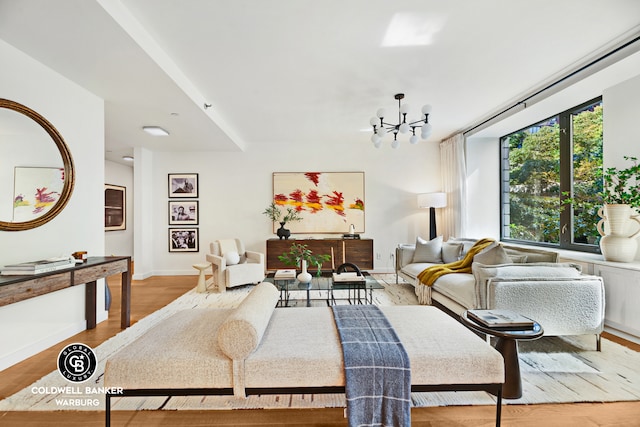 212 E 95th St Unit 2Ab, New York City, NY 10128 - living room featuring a chandelier, wood finished floors, and baseboards