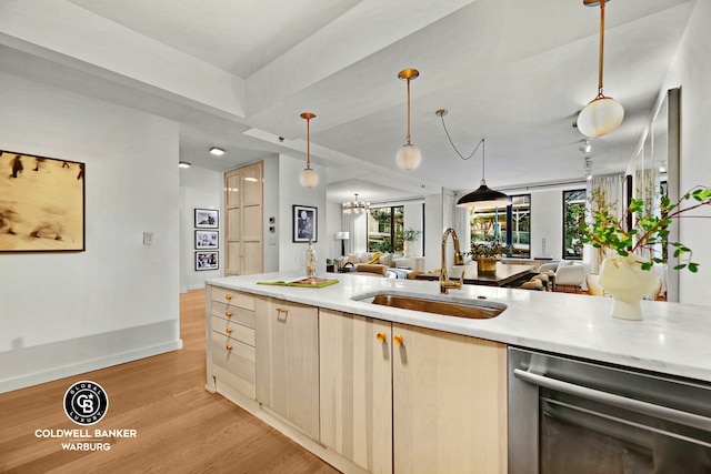 212 E 95th St Unit 2Ab, New York City, NY 10128 - kitchen featuring open floor plan, a sink, dishwasher, light wood finished floors, and decorative light fixtures