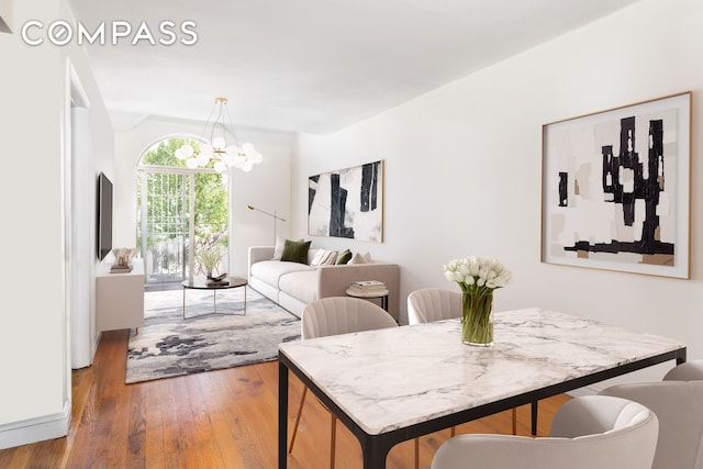 dining room featuring an inviting chandelier and hardwood / wood-style floors