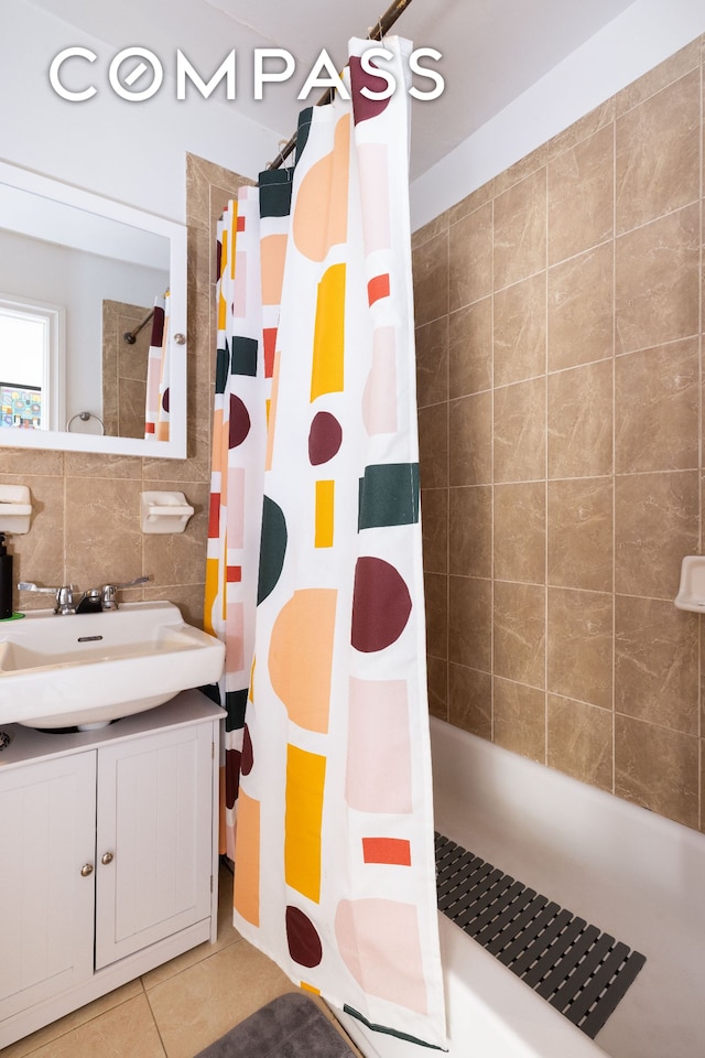 bathroom featuring tile walls, tile patterned floors, vanity, and a shower with shower curtain